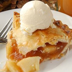 A festive display of fresh apple pie with ice cream and hot cider